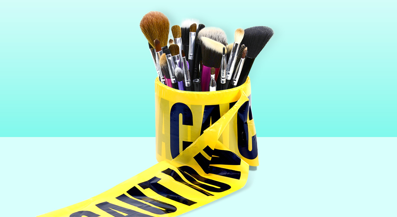 beauty products surrounded by caution tape