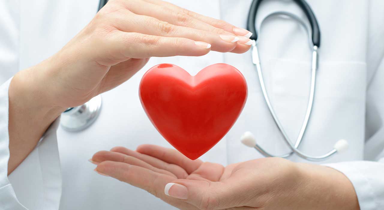 a doctor with a floating heart between her hands