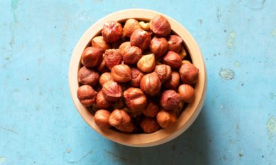 bowl of nuts on a blue background