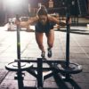 woman pushing the prowler sled