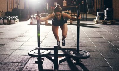 woman pushing the prowler sled