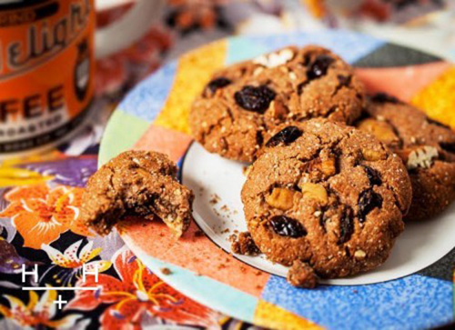 holiday spiced ginger biscuits with nuts and fruit on a colourful plate
