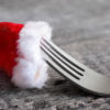 a fork with a santa hat on
