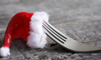 a fork with a santa hat on