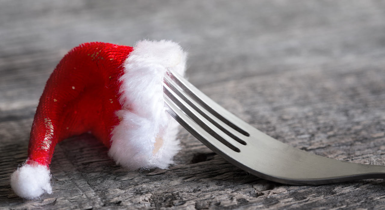a fork with a santa hat on