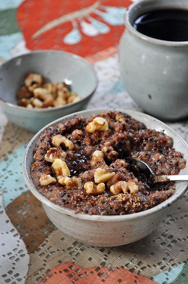 banana nut porridge in a bowl with a silver spoon