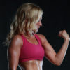 muscular woman flexing her bicep