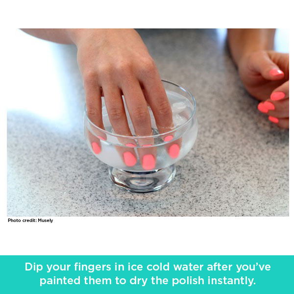 woman dipping her fingers in water