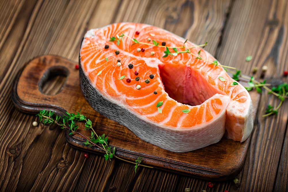 fish on a wooden chopping board