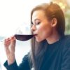 woman drinking a glass of red wine