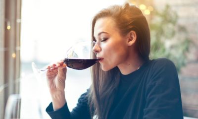 woman drinking a glass of red wine