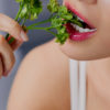 woman eating cilantro