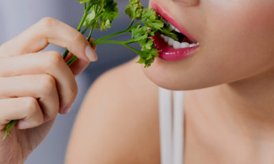 woman eating cilantro