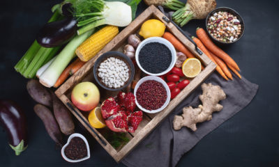 a tray of fruit and vegetables surrounded by fruit and vegetables