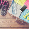 gym clothes and accessories on a wooden floor