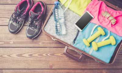 gym clothes and accessories on a wooden floor