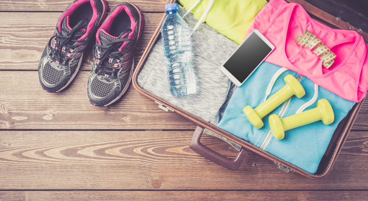 gym clothes and accessories on a wooden floor