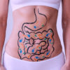 a woman with intestines drawn on her stomach