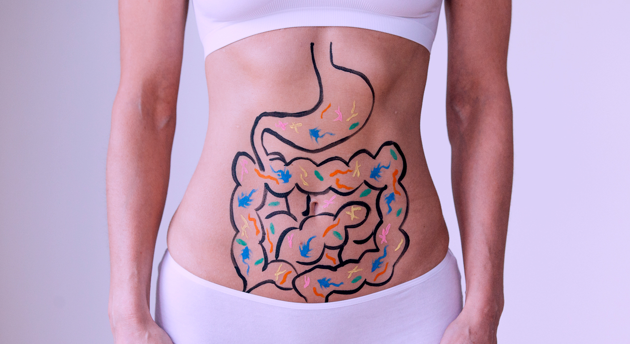 a woman with intestines drawn on her stomach