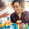 a mother and daughter playing together