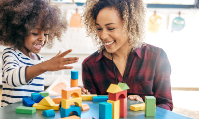 a mother and daughter playing together