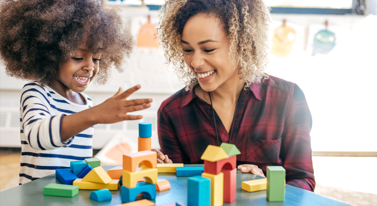 a mother and daughter playing together