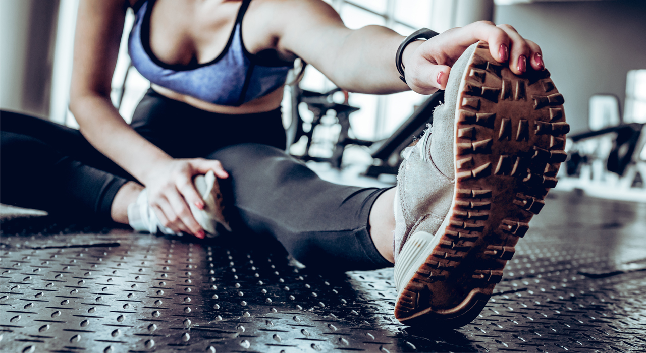 woman stretching in the gym