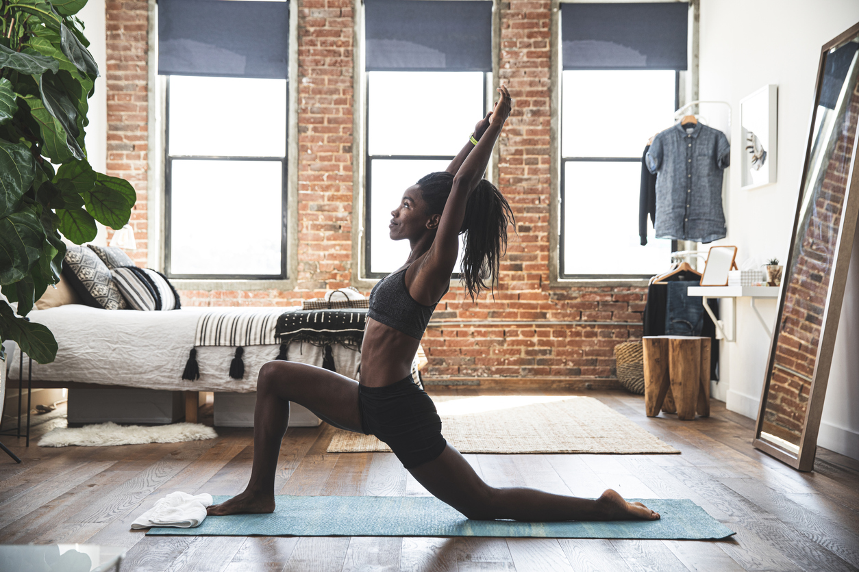 fit woman stretching in her home