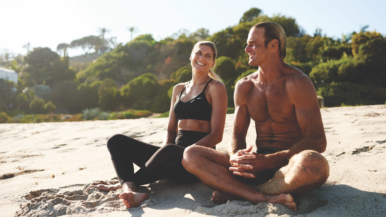 gabrielle reeece laird hamilton on beach