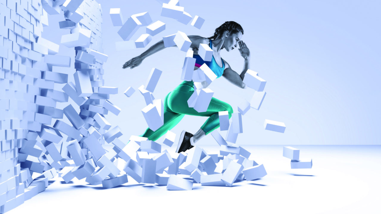 woman running through a wall