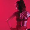 fit woman infront of red background