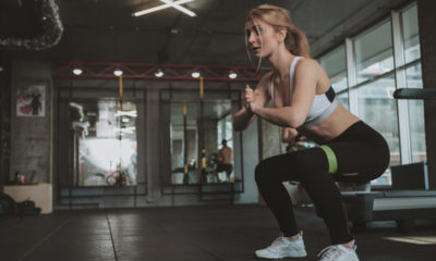 womsn performing exercise with resistance band