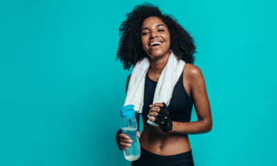 happy woman infront of blue background