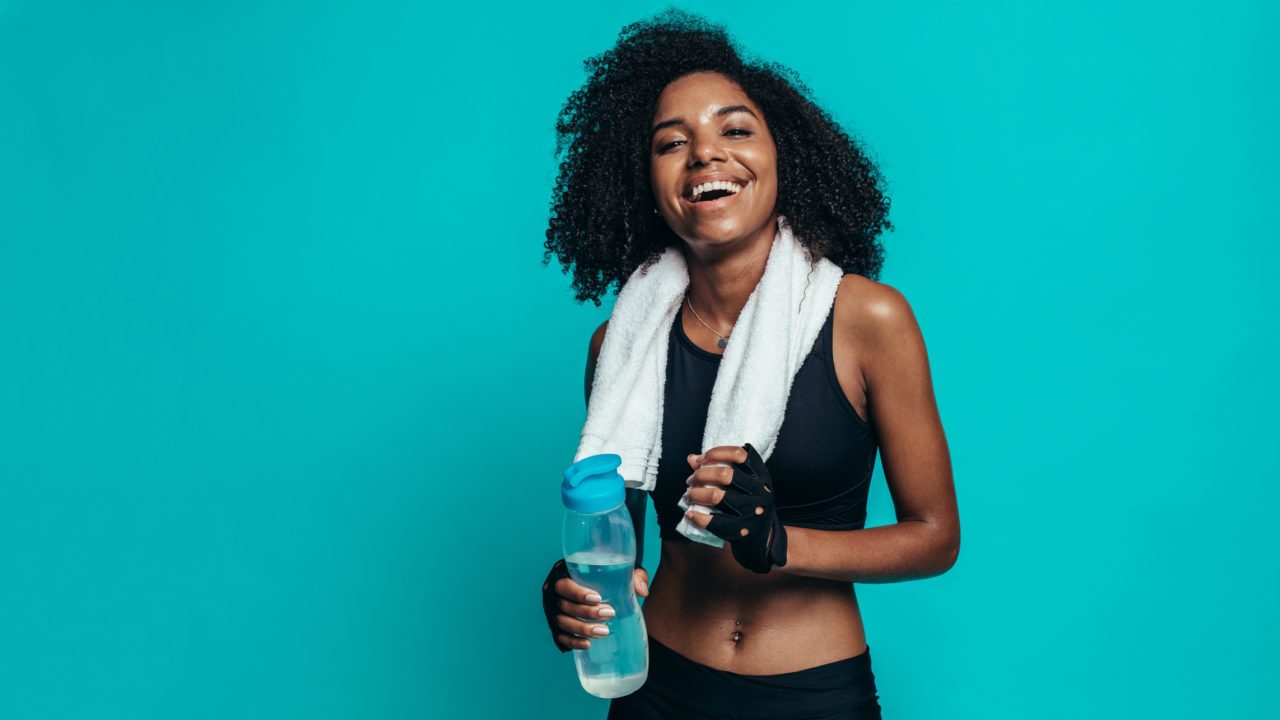 happy woman infront of blue background