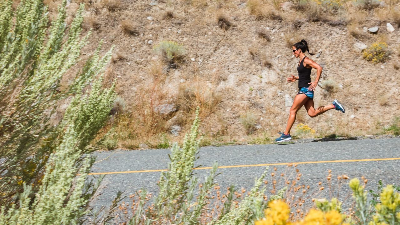 woman running on a outback road