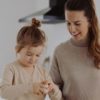 mother and daughter in kitchen cooking