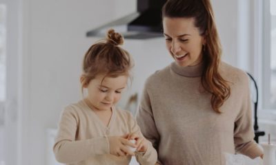 mother and daughter in kitchen cooking